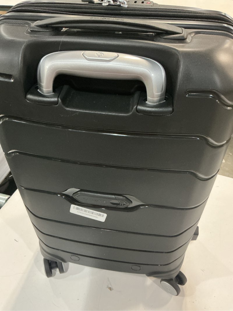 Condition photo showing As Is for samsonite freeform hardside carry-on luggage with spinner wheels - hardshell suitcase - tsa, airline-approved - expandable hard shell, smooth rolling wheels for lightweight travel – black carry-on spinner black
