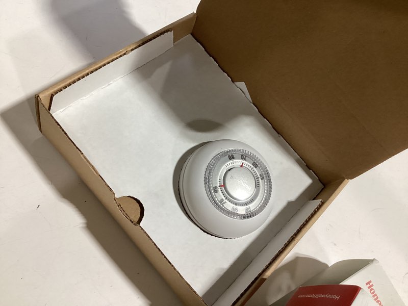 Condition photo showing As Is for honeywell premium heat only honeywell round