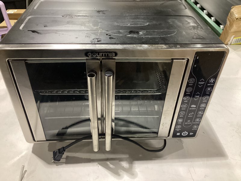 Condition photo showing As Is for black+decker crisp  n bake air fryer toaster oven combo  12 in 1 countertop convection oven cooks food fast  fits a whole pizza or 6 toast slices  french doors with stainless steel finish