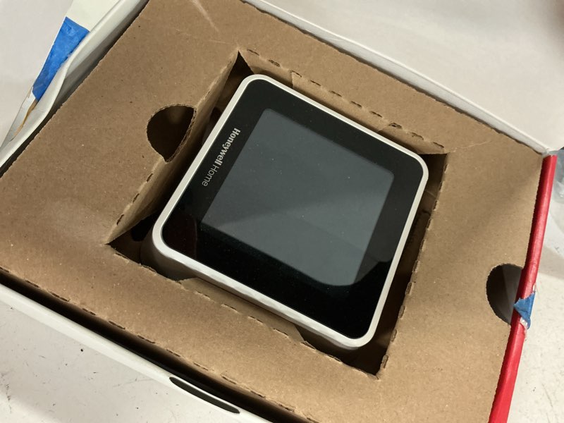 Condition photo showing As Is for honeywell home black/white smart thermostat with wi-fi compatibility