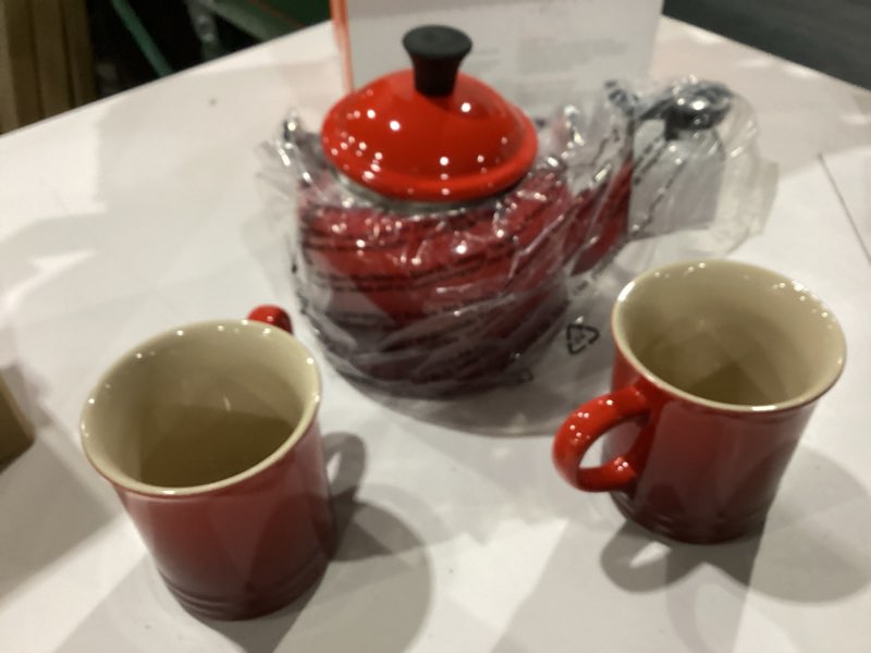 Condition photo showing New/Like New for le creuset enamel on steel demi kettle with metal finishes & stoneware set of 2 mugs, 1.25 qt. kettle & (2) 14 oz. mugs, flame