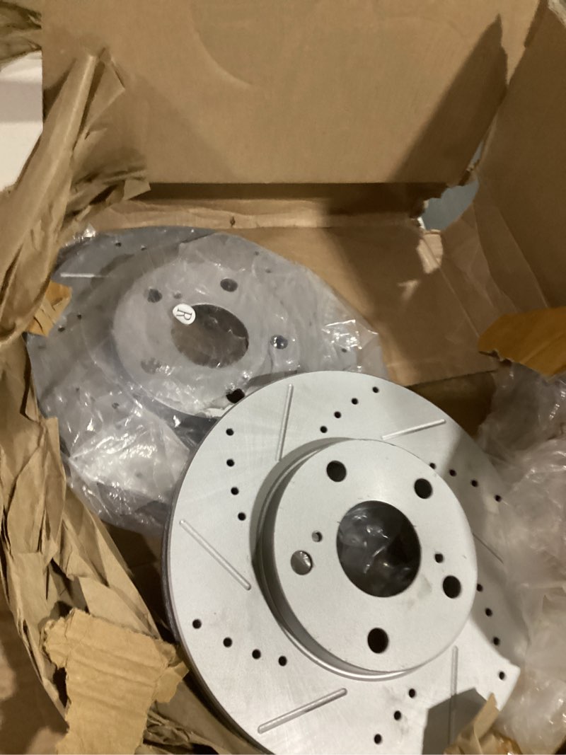 Condition photo showing As Is for front brake rotors drilled  **only rotors**