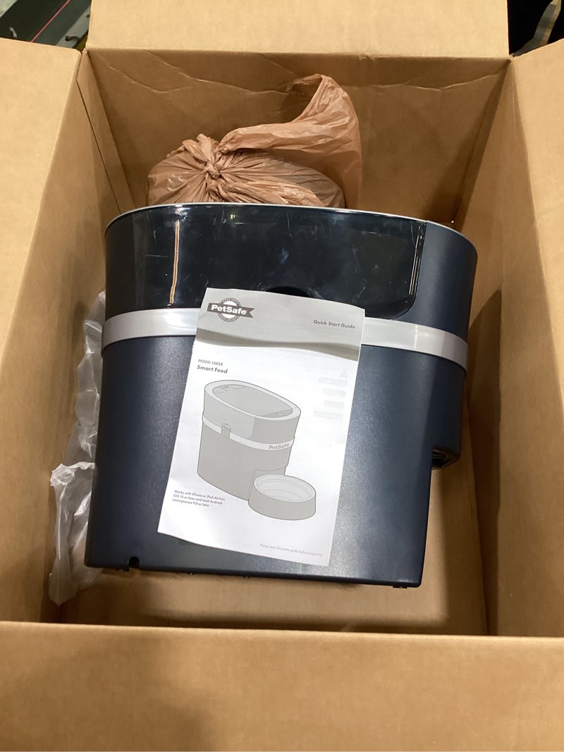 Condition photo showing As Is for petsafe smart feed pet feeder, automatic cat feeder, automatic dog feeder with app, compatible with alexa, apple, android, backup batteries for power outage, black smart feed only