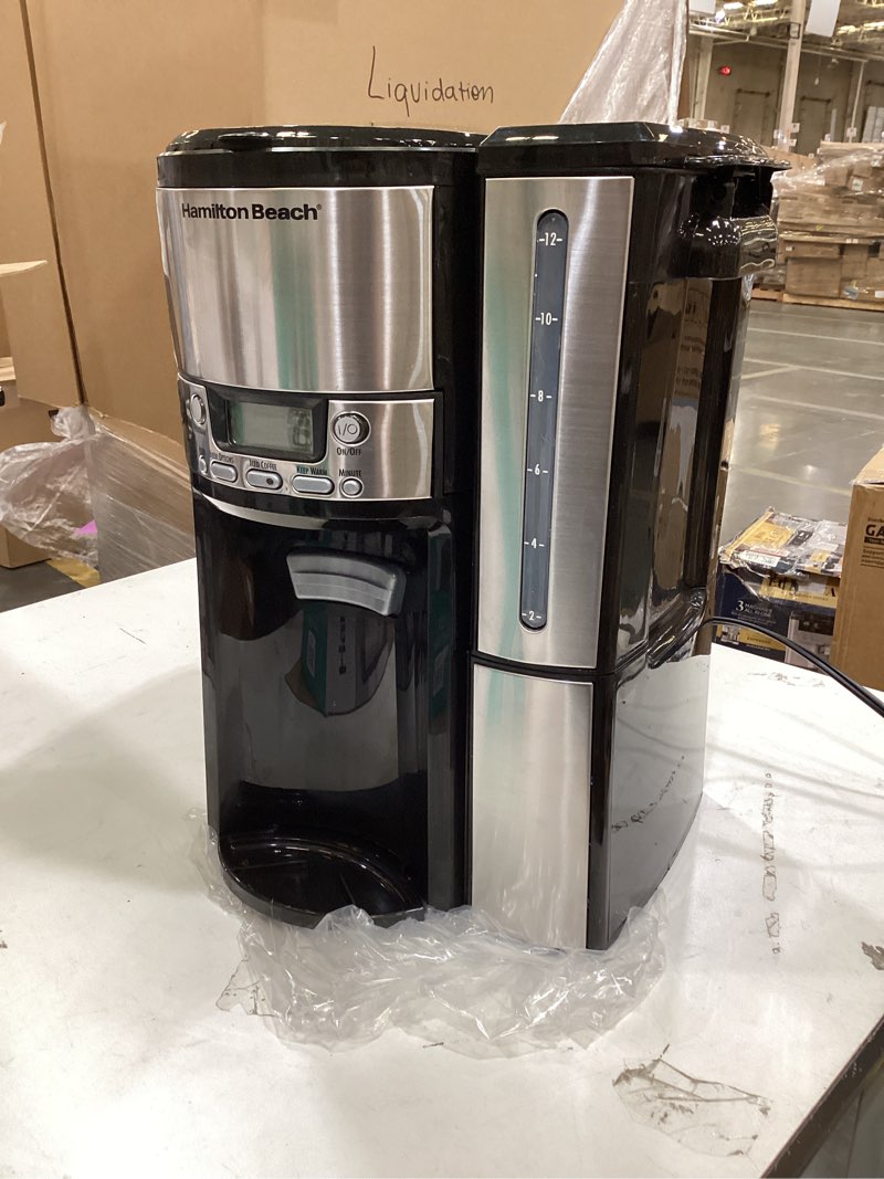 Condition photo showing As Is for hamilton beach one press programmable dispensing 12 cup coffee maker with internal coffee pot, stays warm and fresh for hours, 60 oz. removable reservoir, black & stainless steel (47950) black and silver