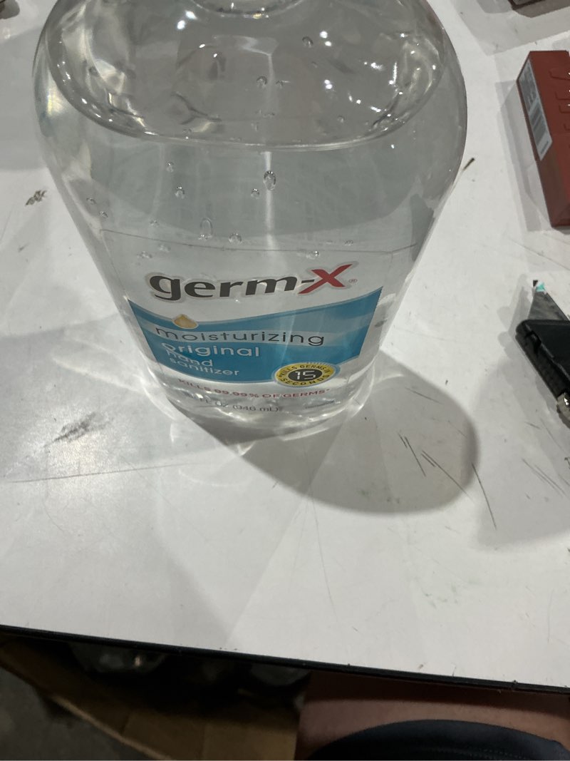 Condition photo showing As Is for (exp)germ-x moisturizing original hand sanitizer, 32 oz