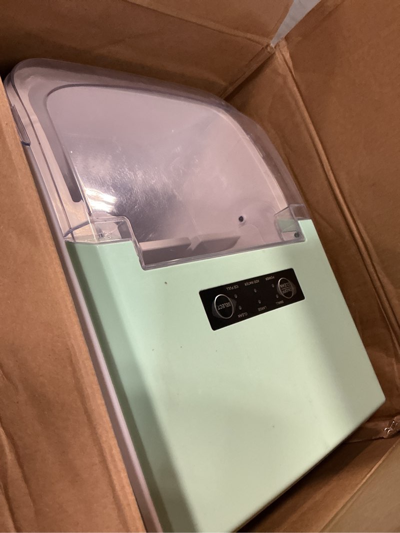 Condition photo showing As Is for newbulig ice makers countertop with handle, portable ice machine, 9 bullet ice cubes in 6 mins, 26lbs in 24hrs, auto-cleaning, with basket and scoop, for home, kitchen, rv, camping, green green handle 12.5"*11.6"*8.8"