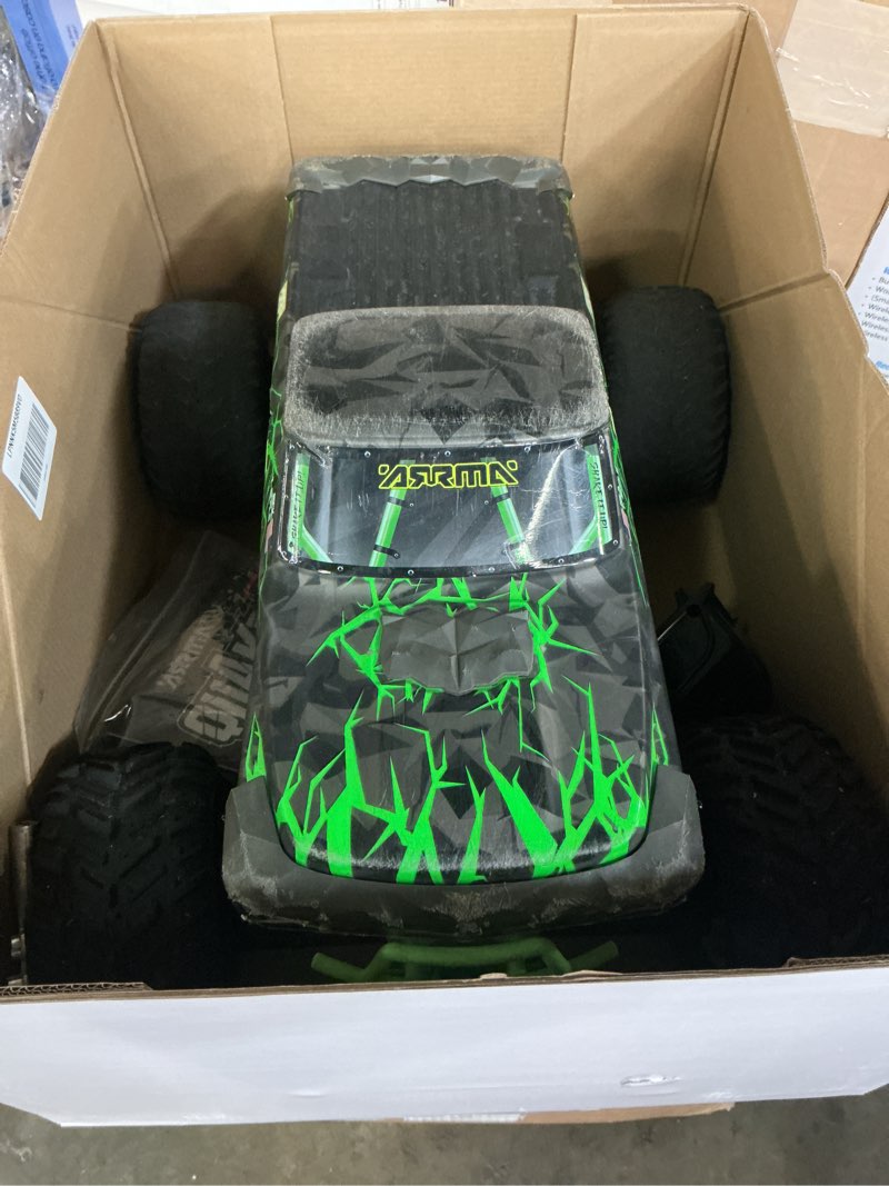 Condition photo showing As Is for arrma rc truck 1/10 quake 223s 2wd rtr (battery and charger not included) brushless monster truck, red, ara3537t1