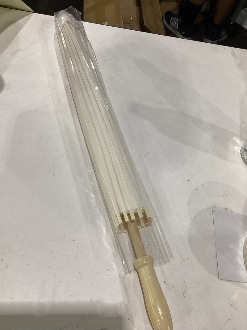 Condition photo showing Good Condition for decorative paper parasol umbrella featuring bamboo ribs and wooden handle