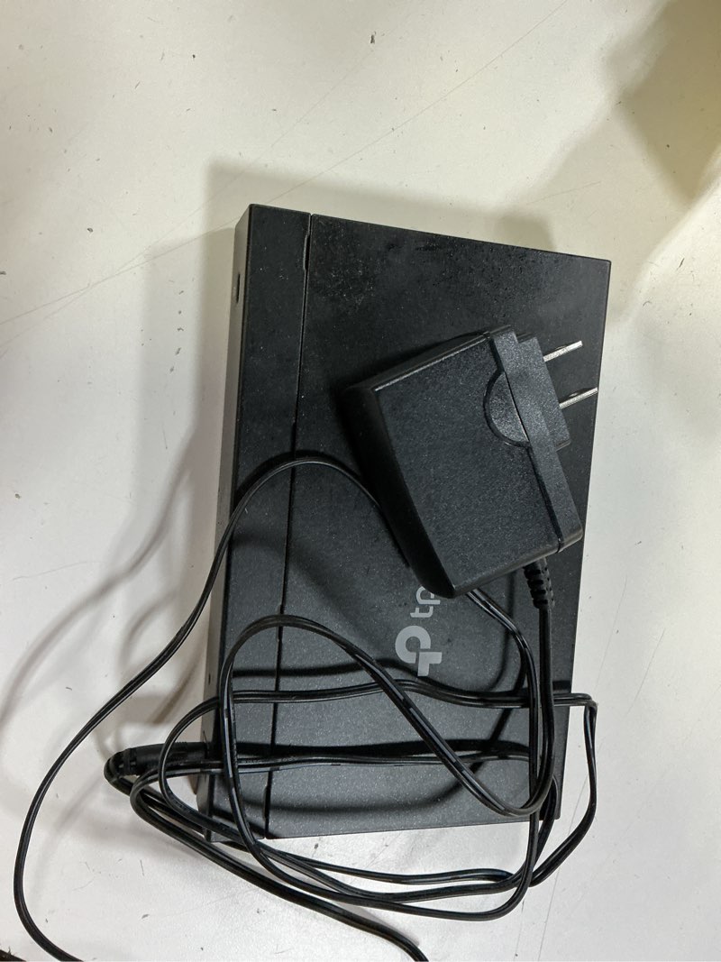 Condition photo showing As Is for tp-link 8 port gigabit switch | easy smart managed | plug & play | desktop/wall-mount | sturdy metal w/ shielded ports | support qos, vlan, igmp and lag (tl-sg108e) 8 port | enhanced features