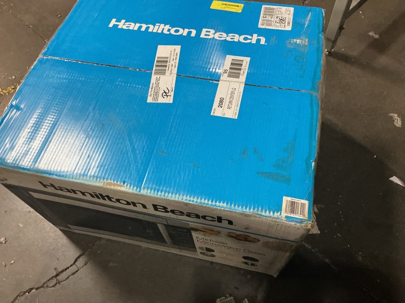 Condition photo showing As Is for hamilton beach 1.6 cu ft sensor cook countertop microwave oven in stainless steel, new