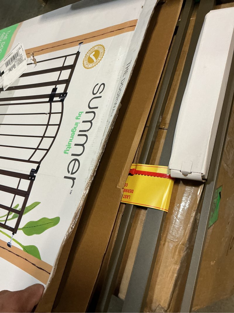 Condition photo showing New/Like New for ingenuity decorative extra tall baby gate & dog gate, 28.5"-48" wide, 36" tall, hardware or pressure mounted, install on top or bottom of stairs, banister, or doorway - bronze