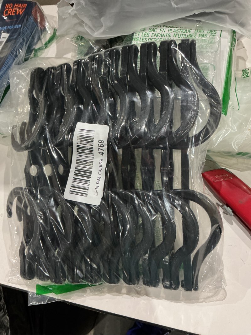 Condition photo showing New/Like New for house day black magic space saving hangers 10 pack, premium smart hanger hooks, sturdy cascading hangers with 5 holes for heavy clothes, closet organizers and storage, college dorm room essentials 10 pack black