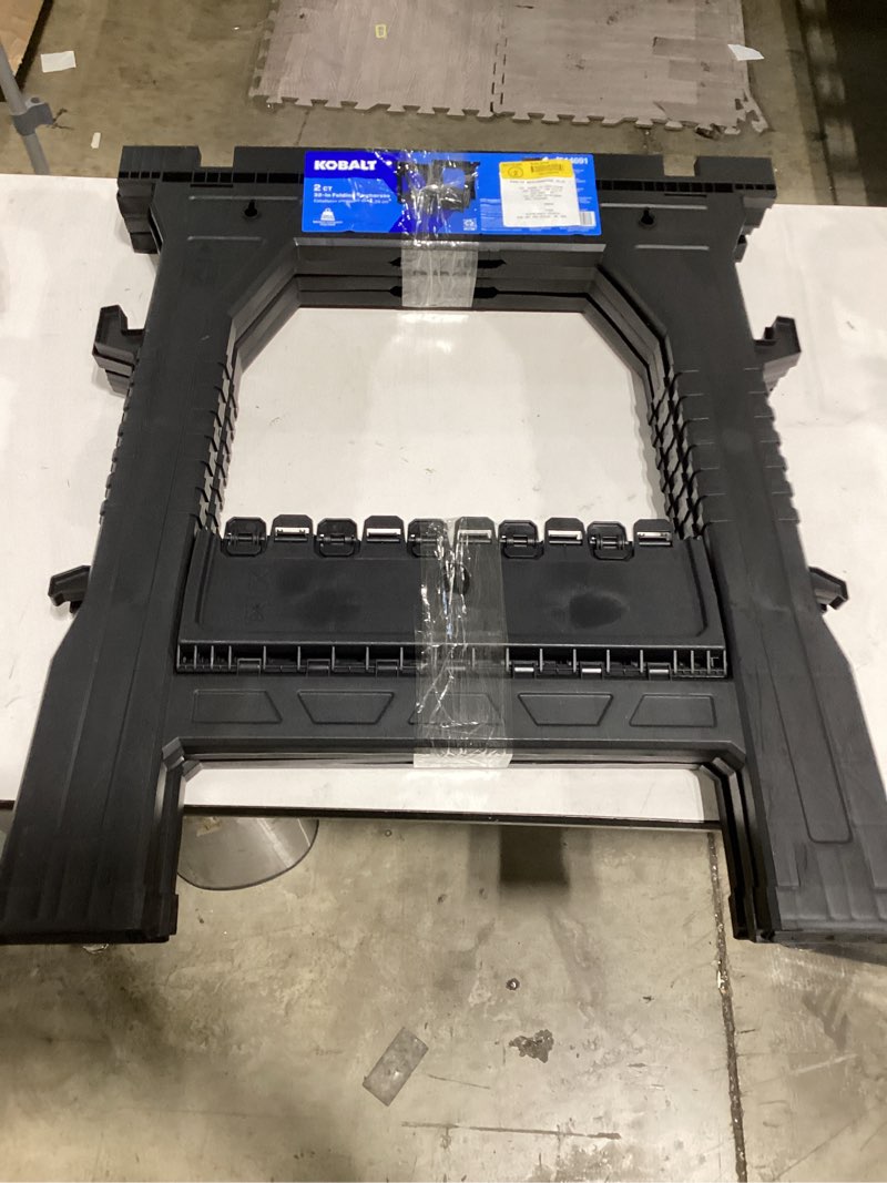Condition photo showing As Is for kobalt 2-pack 27-in w x 32-in h plastic saw horse (1000-lb capacity)