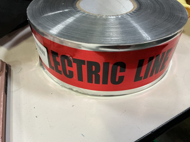 Condition photo showing Good Condition for industry standard 3 inch x 1000 foot 5 mil detectable safety tape caution buried electric below red/black print