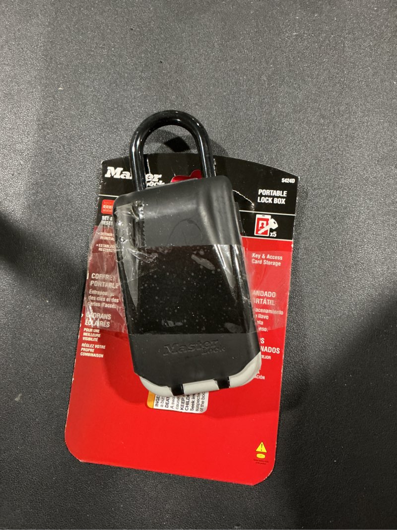 Condition photo showing Good Condition for Master Lock Black Portable Key Lock Box with Light Up Dials, Set/Reset Combination for Tenants, Guests, Clients, Ideal for Realtors, Landlords or Property Managers, Holds 6 Keys, 5424EC