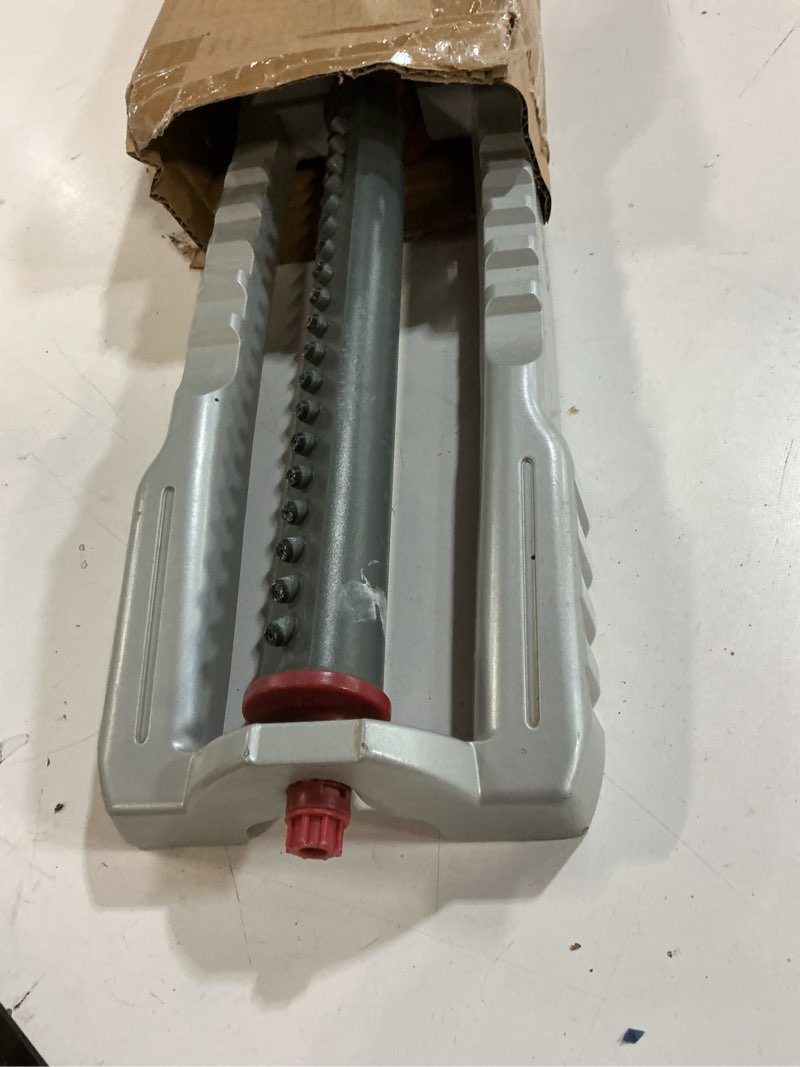 Condition photo showing As Is for orbit 56281 oscillating water sprinkler for lawn and garden with metal base and custom pattern dial (waters up to 4,000 square feet) 4000 sq ft metal