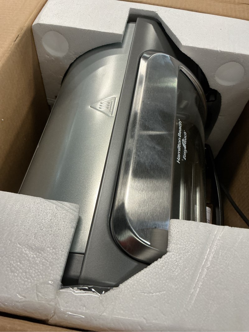 Condition photo showing Good Condition for hamilton beach easy reach 4-slice countertop toaster oven with roll-top door, 1200 watts, fits 9” pizza, 3 cooking functions for bake, broil and toast, silver (31344da) silver 4-slice