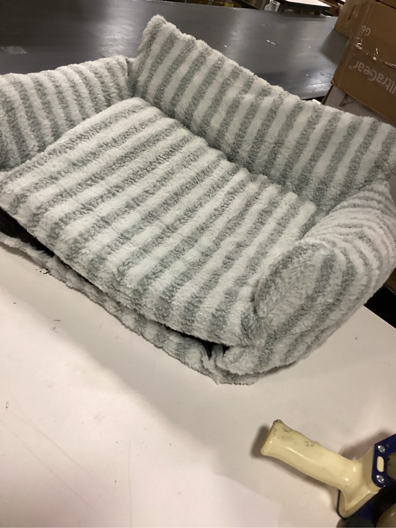 Condition photo showing As Is for wholesale grey and white striped couch style dog bed