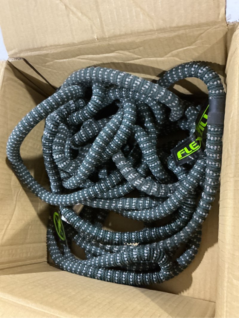 Condition photo showing As Is for (Similar to stock photo) Flexi Hose Expandable Garden Hose with 8 Function Nozzle, 100FT - Lightweight Retractable Garden Hose, Water Hose - No-Kink Flexibility, 3/4 Inch Solid Brass Fittings and Double Latex Core 100ft Black
