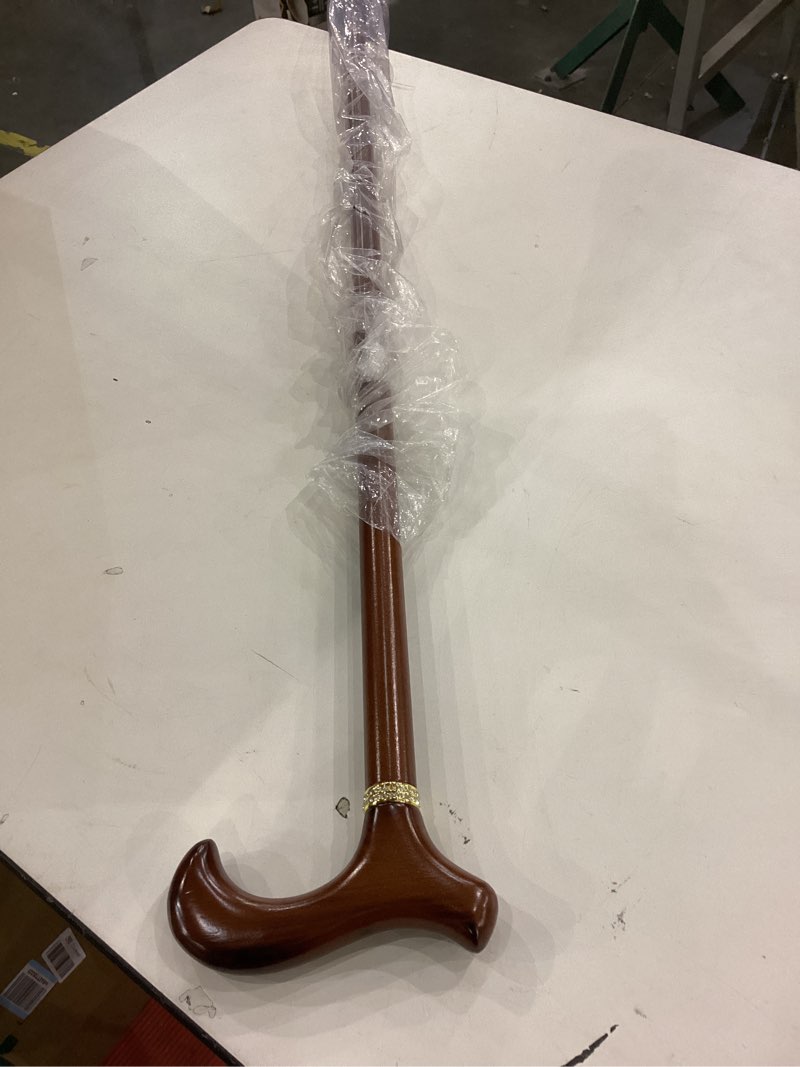 This is a wooden walking cane with a derby handle and a high-gloss cherry finish.  