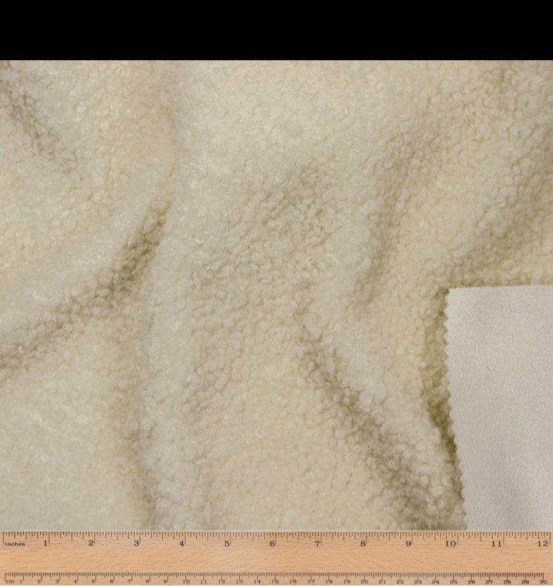 This heavyweight woven fabric is made of 100% Polyester. It has a sherpa face and a suede backing. The texture is warm, soft and fluffy, useful for making jackets , coats, accessories and home décor.