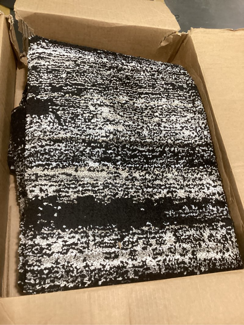 Condition photo showing As Is for garland rug jasper 5 ft. x 7 ft. area rug, non slip, abstract rug, foldable, stain resistant rugs for living room, bedroom, modern, black/earth tone