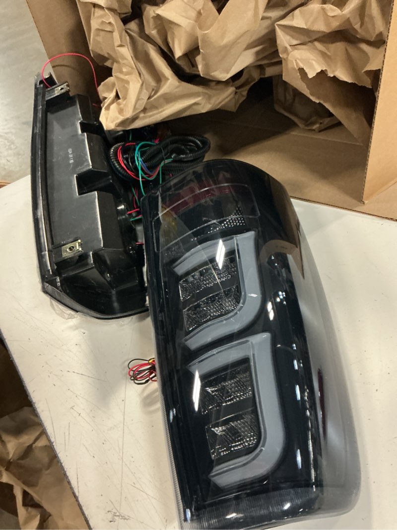 Condition photo showing Good Condition for pit66 led tail lights replacement compatible with chevy silverado 2003-2006 gm2800174, gm2801174 smoky(w/wiring harness) rear light lamp assembly