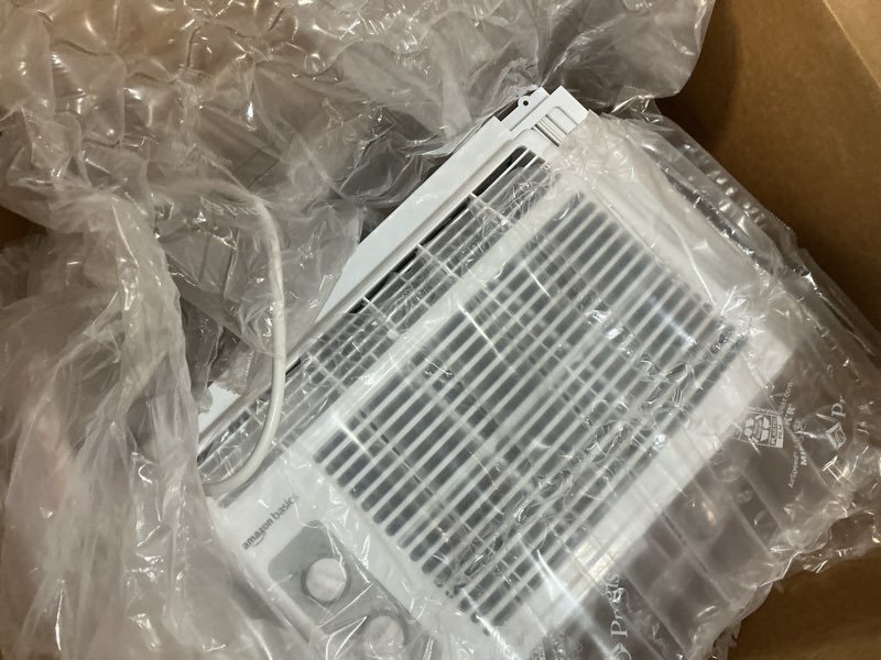 Condition photo showing As Is for Amazon Basics 5000-BTU Small Window Air Conditioner, Up to 150 Sqf, Window AC Units with Cool and Fan Functions, Washable Filter, Adjustable Window Kit, Intuitive Mechanical Controls, White White 5000 BTU