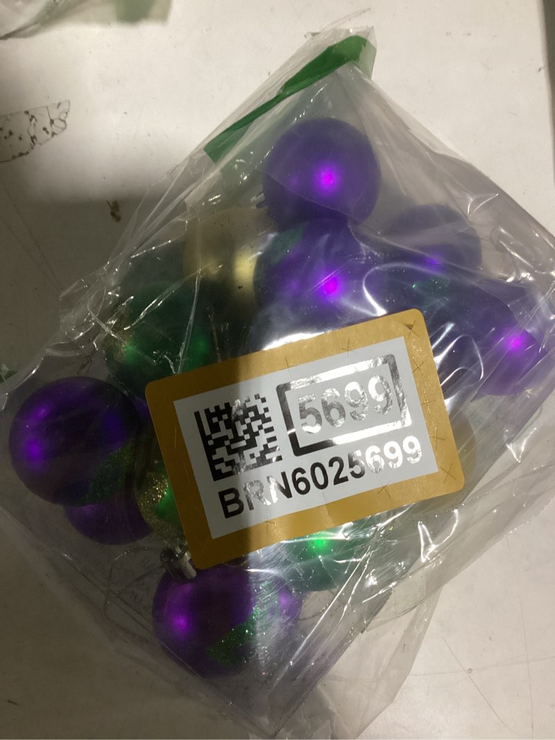 Condition photo showing New/Like New for Deloky 24 PCS Mardi Gras Hanging Ball Ornaments-1.57 Inch Mardi Gras Shatterproof Ball-Purple Green Gold Tree Ornaments for Mardi Gras New Orleans Masquerade Party Decoration