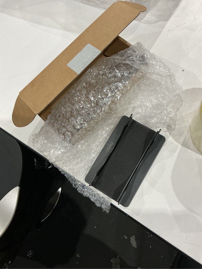 Condition photo showing As Is for metal desktop stand for 2024 mac mini m4/m4 pro, perfect for desk organization and heat dissipation?soft cushioned protection, space-saving design- black