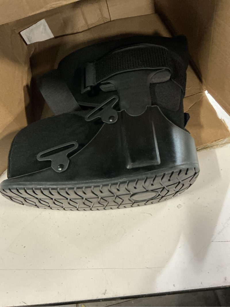 Condition photo showing As Is for united ortho short air cam walker fracture boot, large, black black large boot