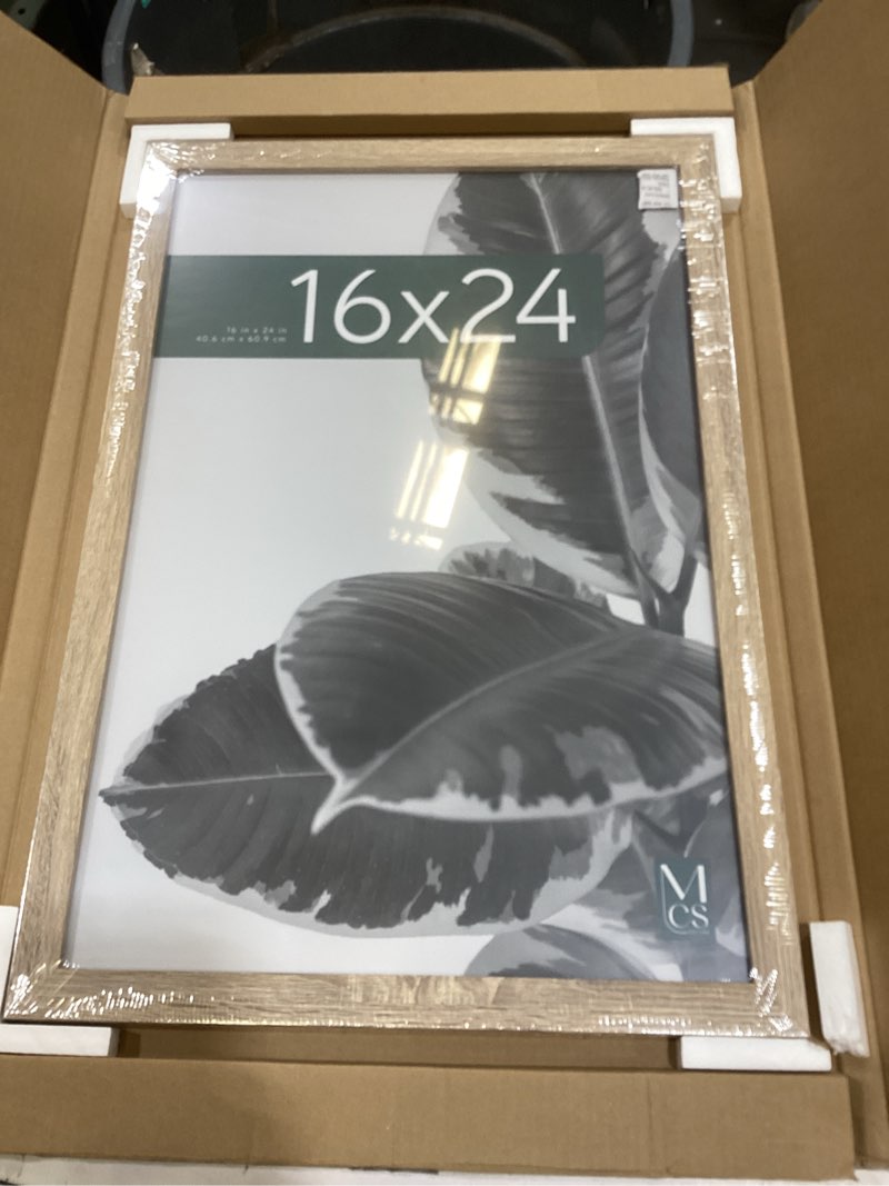Condition photo showing Good Condition for mcs studio gallery 16x24 poster frame natural woodgrain engineered wood, vertical & horizontal wall hanging large picture frame for photos, posters & art prints (1-pack) 1-pack natural woodgrain 16x24