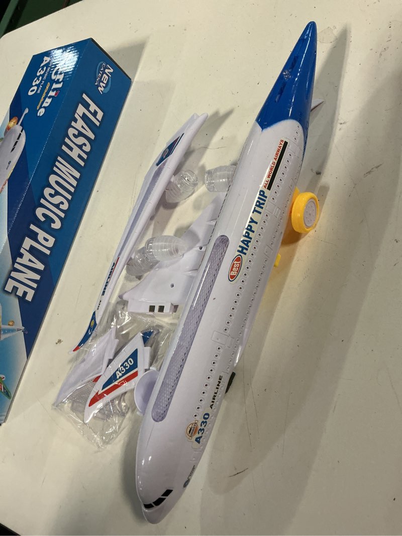 Condition photo showing New/Like New for airline toy airplane with music and led lights