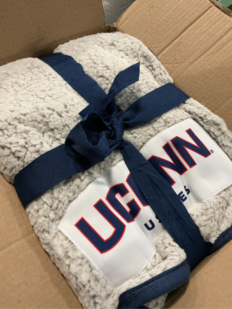 Condition photo showing Good Condition for Logo Brands Officially Licensed NCAA Unisex Frosty Fleece Blanket, One Size, Team Color Connecticut Huskies 50 x 60 inches