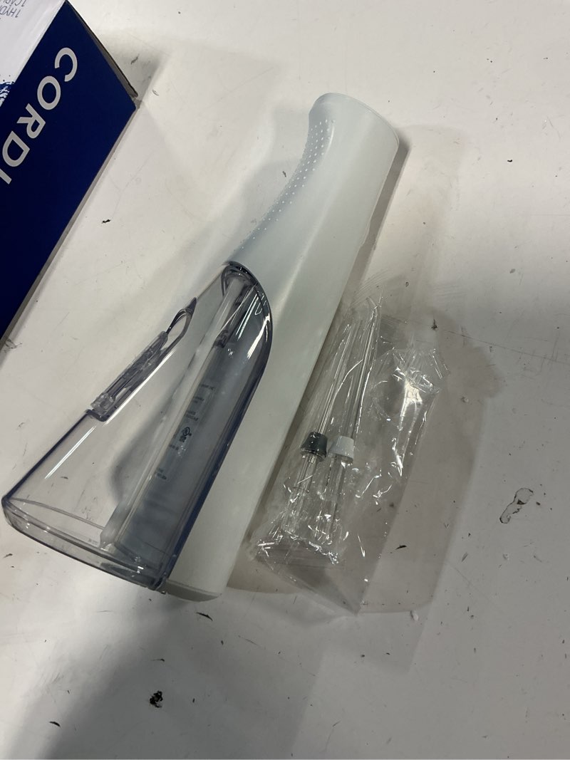 Condition photo showing Good Condition for Waterpik Cordless Pulse Rechargeable Portable Water Flosser for Teeth, Gums, Braces Care and Travel with 2 Flossing Tips, Waterproof for Shower, ADA Accepted, WF-20 White, Packaging and Tips May Vary