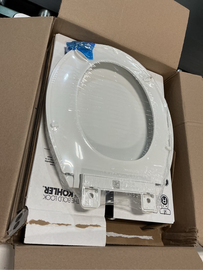 Condition photo showing New/Like New for kohler 20111-0 brevia, slow close toilet seat, round toilet seat, grip-tight bumpers quick-attach hardware, white