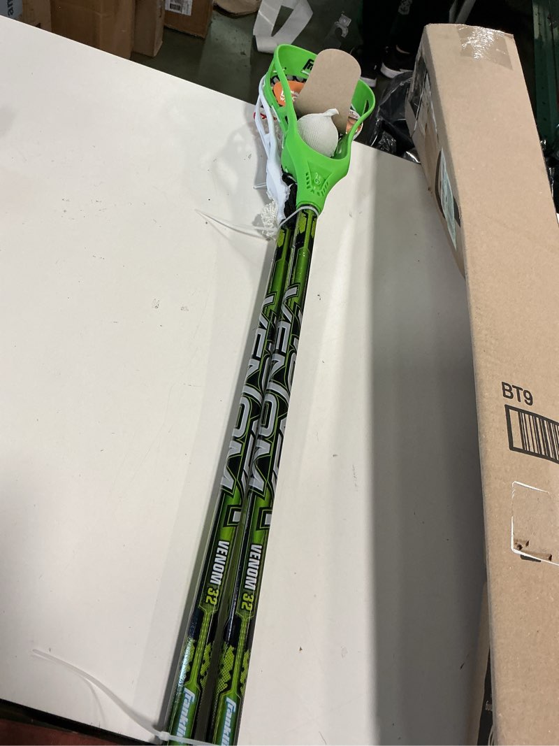 Condition photo showing Good Condition for Franklin Sports Future Champs 2 Player Youth Lacrosse Sticks + Ball Set - Kids 32" Inch Beginner Backyard Practice Lax Sticks + Lightweight Soft Lacrosse Ball - Toy Kids Lax Set Green and White