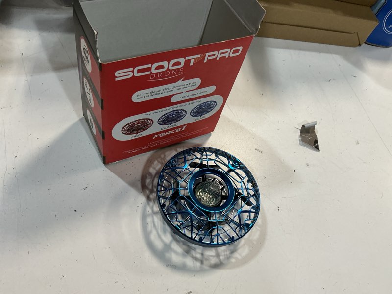 Condition photo showing As Is for force1 scoot pro hand operated drone for kids or adults - induction hands free motion sensors mini drones with bright led projection, 360 flips, easy indoor small ufo flying orb ball drone toy pro blue