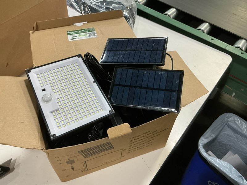 Condition photo showing As Is for outdoor solar lights, split solar motion sensor outdoor lights with remote control, ip65 waterproof solar lights, 172led 3modes solar flood lights for yard,patio,garden,garage, 4 pack