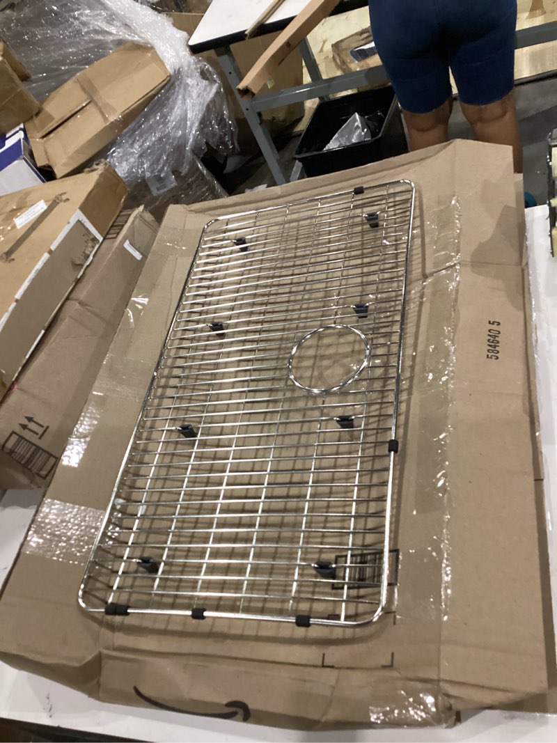Condition photo showing As Is for elkay 15.25-in x 28.25-in back center drain stainless steel sink grid