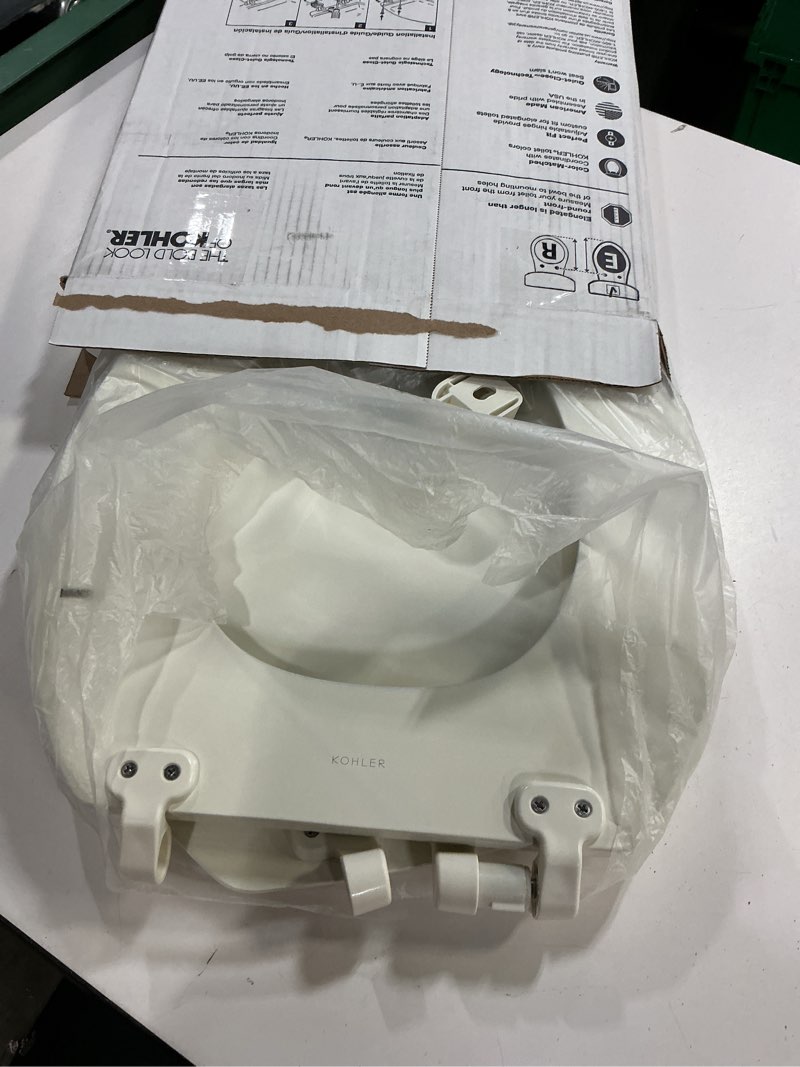 Condition photo showing As Is for kohler stonewood quiet-close, elongated toilet seat soft close, durable wood, easy installation, universal fit, home essentials, biscuit finish, k-20466-96 biscuit elongated double-hinge