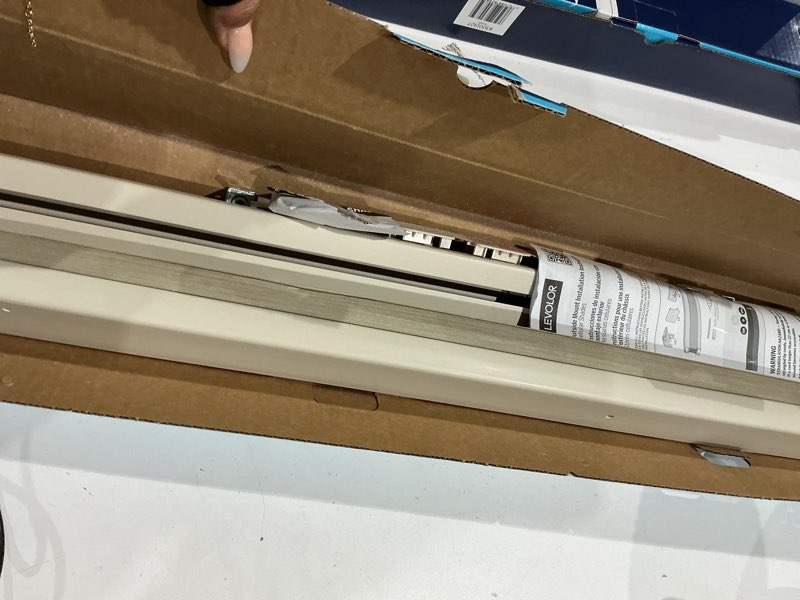 Condition photo showing As Is for levolor 48-in x 72-in sand blackout cordless cellular shade