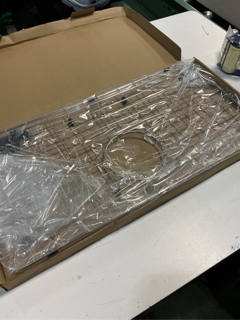 Condition photo showing New/Like New for Serene Valley 25-1/4" X 12-1/2“ Sink Grid, Rear Drain with Corner Radius 1-1/2", NLW2513R