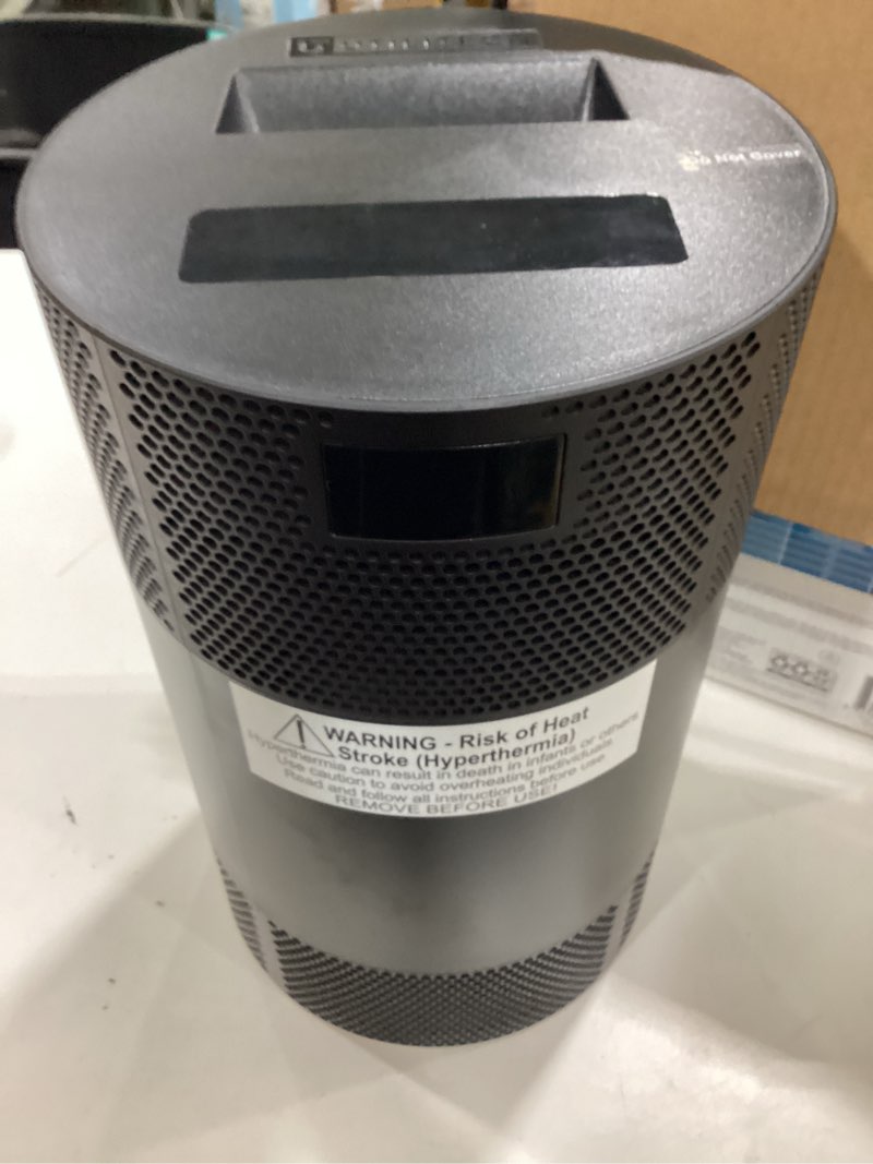 Condition photo showing As Is for utilitech 360° ceramic heater #5703324 w/ remote