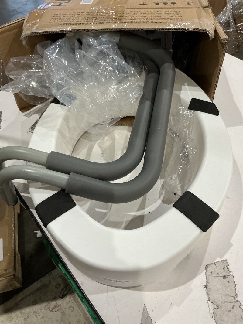 Condition photo showing As Is for carex 3.5 inch raised toilet seat with arms, elongated toilet seat riser, up to 250 lbs capacity, elevating & raising seat for elderly & handicap, universal, slip-resistant with padded handles, white