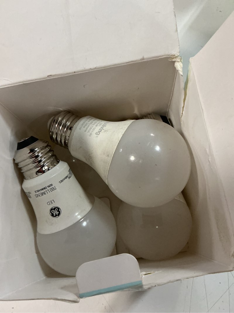 Condition photo showing As Is for merkury smart led bulbs - 9w (60w eqv) rgbw dimmable a19 light, e26 base (4-pack)