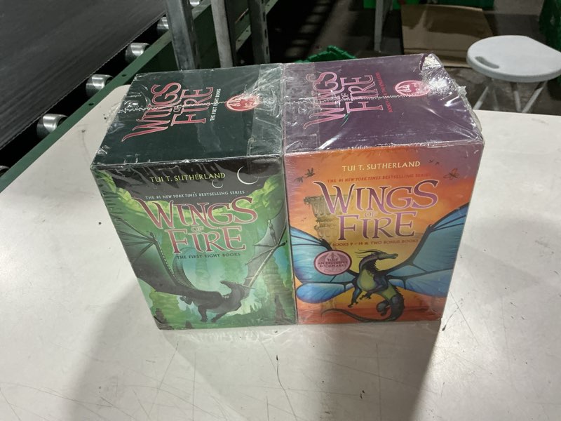 Condition photo showing New/Like New for wings of fire (8 books)