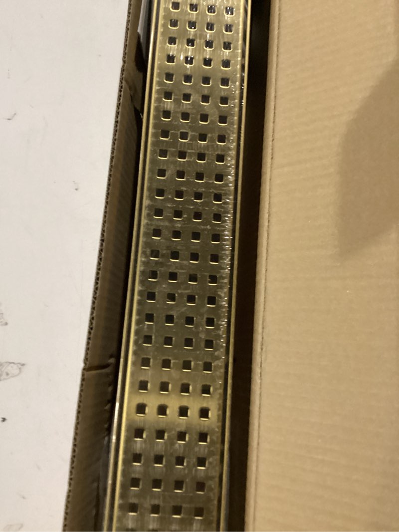 Condition photo showing New/Like New for htoh linear shower drain, 24 inch gold shower drain with removable square hole cover grate, bathroom modern 304 stainless steel brushed gold shower floor drain with adjustable feet,hair catcher brushed gold 24in