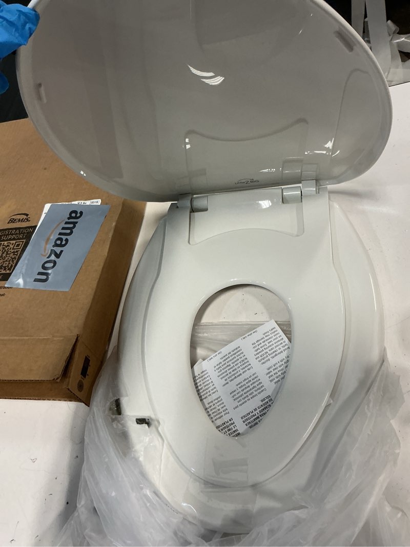 Condition photo showing Good Condition for Mayfair Little2Big? Elongated Plastic Toilet Seat in White with STA-TITE? Seat Fastening System? and Whisper•Close? Hinge