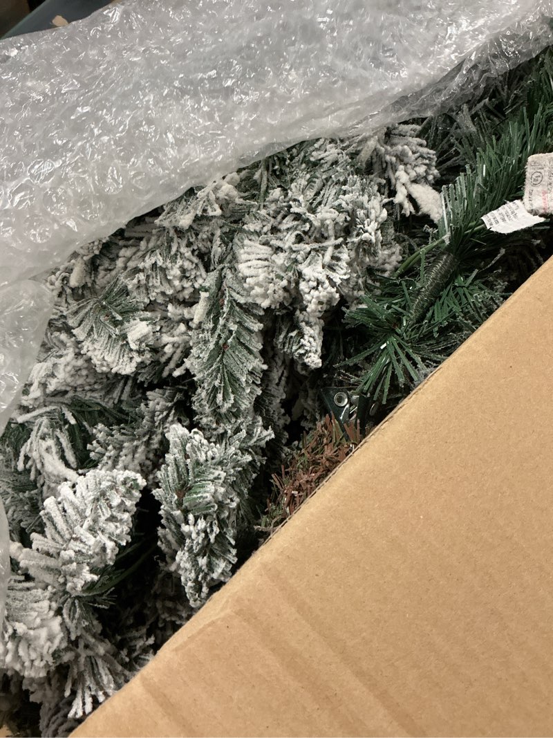 Condition photo showing As Is for puleo international 6.5ft pre-lit flocked bennington fir christmas tree with 350 clear lights, 943 realistic dense snow flocked branch tips, easy setup artificial trees with sturdy metal stand 6.5' flocked bennington fir with 350 clear lights